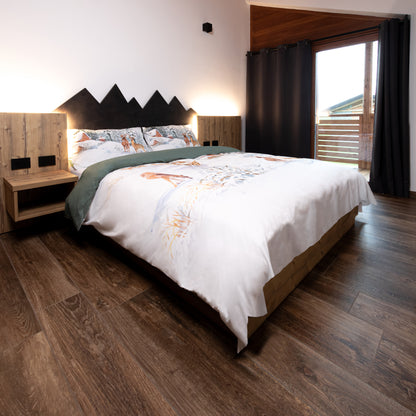 Parure copripiumino White Mountain in 100% cotone Daunex ambientata