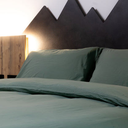 Parure copripiumino no stiro Fresh cotton stone wash Daunex ambientata colore verde dettaglio federe.