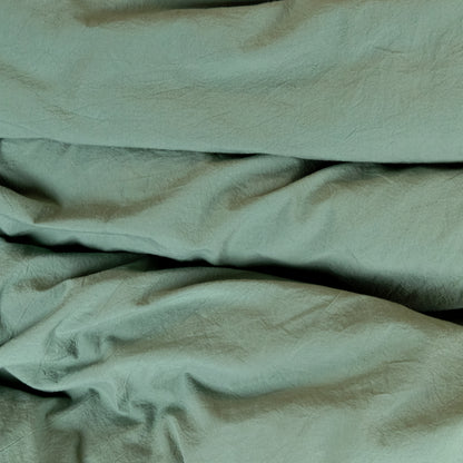Parure copripiumino no stiro Fresh cotton stone wash Daunex ambientata colore verde dettaglio tessuto.
